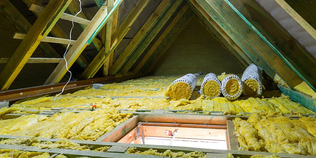 Empty attic in the house with mineral wool insulation