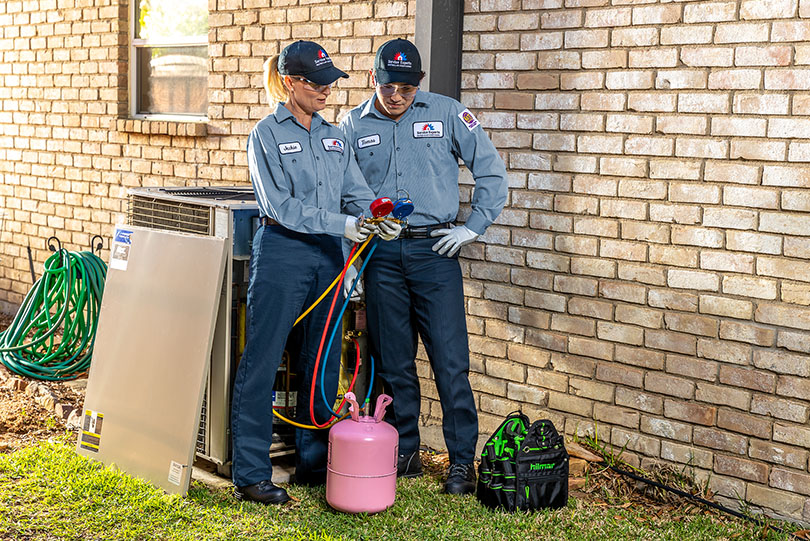 HVAC techs working outside
