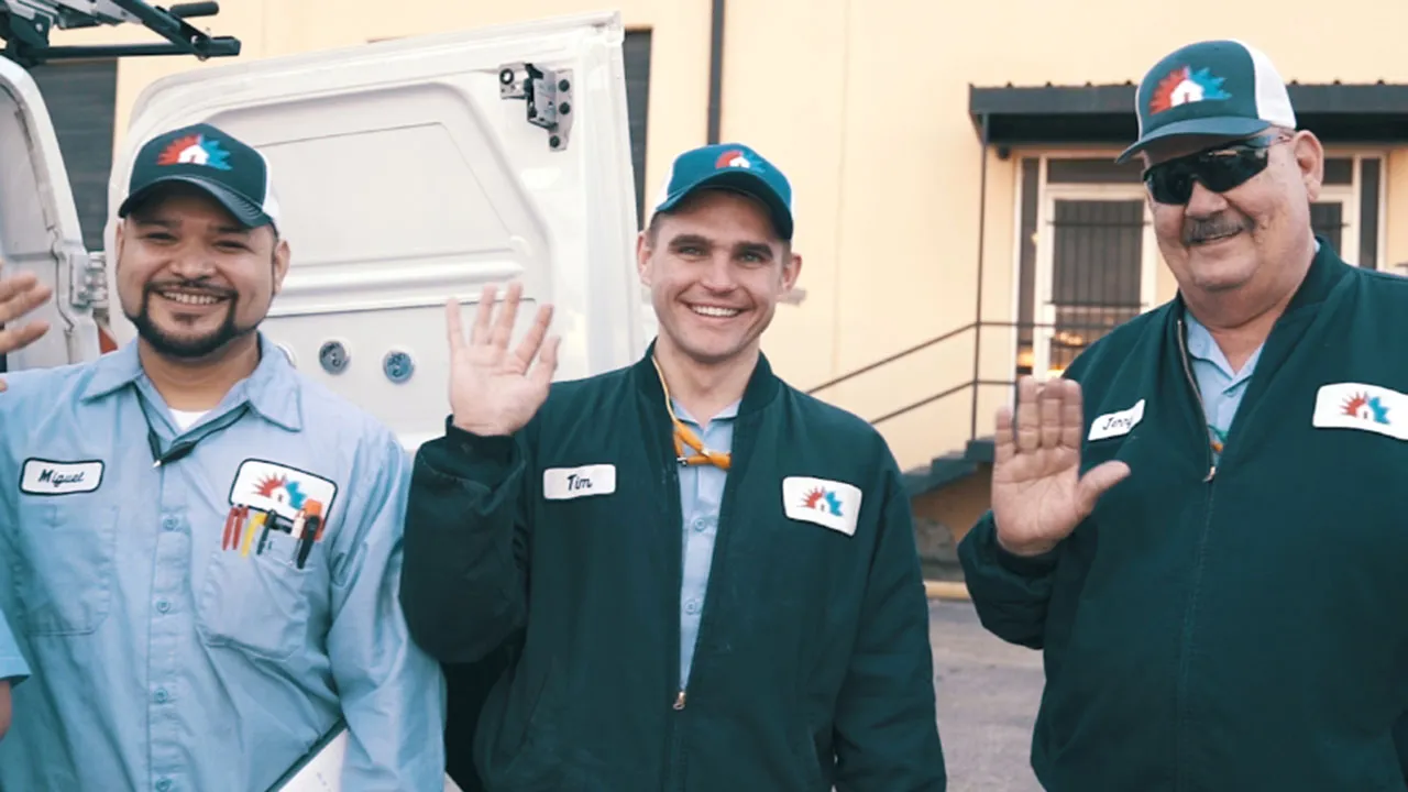 Three technicians waving hello