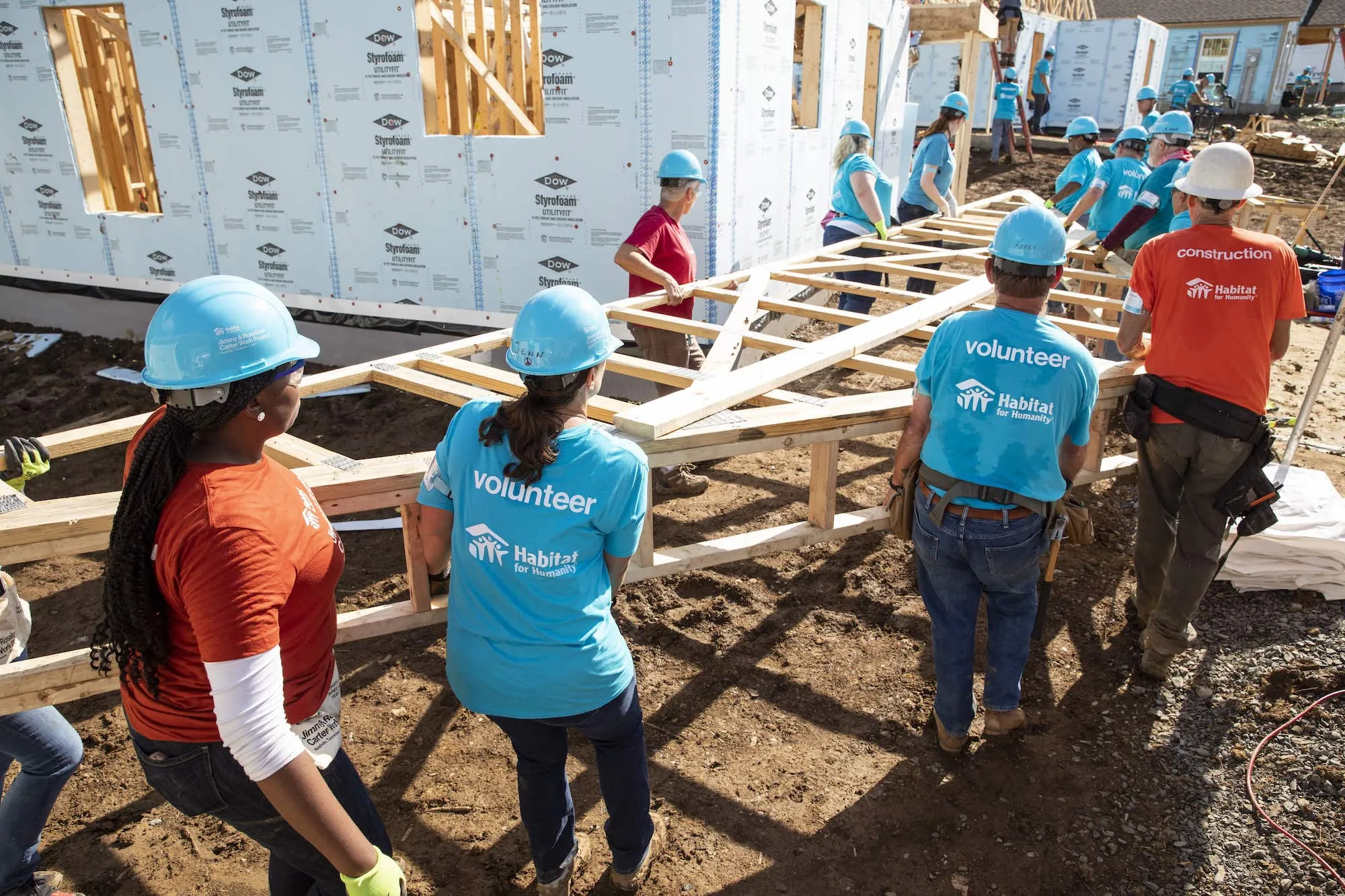 Service Experts volunteering to build a home